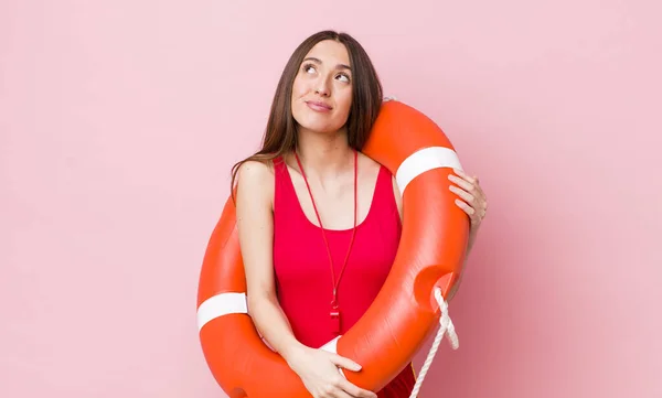 Hispanic Pretty Woman Shrugging Feeling Confused Uncertain Lifeguard Concept — Stock Photo, Image