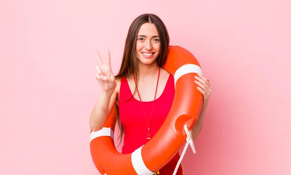 Hispanic Pretty Woman Smiling Looking Friendly Showing Number Two Lifeguard — стоковое фото