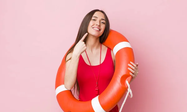 Hispanic Pretty Woman Smiling Confidently Pointing Own Broad Smile Lifeguard — Stock Photo, Image