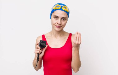 Genç ve güzel bir kadın kapiş ya da para hareketi yapıyor, sana ödemeni söylüyor. Zamanlayıcı ile yüzücü