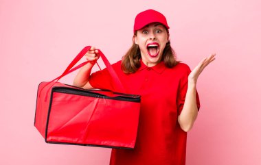 young pretty woman  feeling happy and astonished at something unbelievable. pizza delivery concept