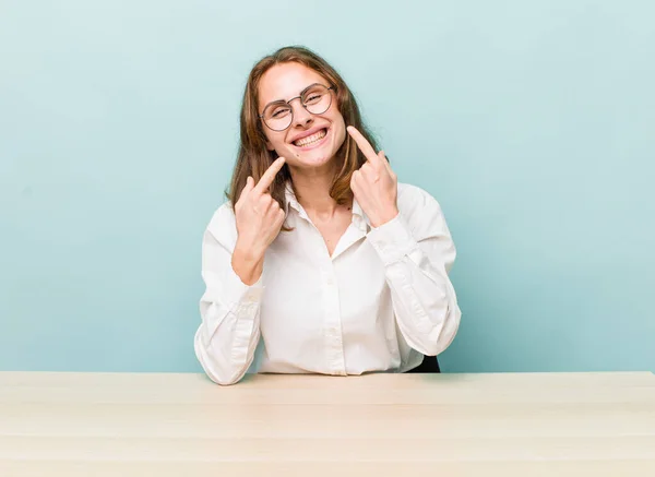 Young Pretty Woman Smiling Confidently Pointing Own Broad Smile Desk — Stockfoto