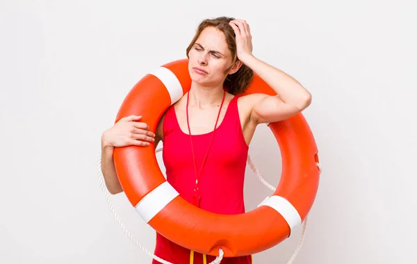 Young Pretty Woman Feeling Puzzled Confused Scratching Head Lifeguard Concept — Stock Photo, Image