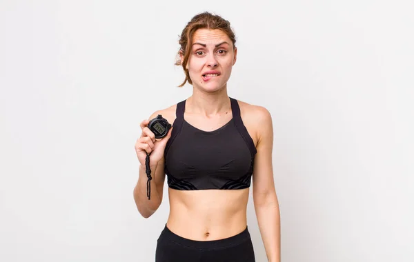 Young Pretty Woman Looking Puzzled Confused Fitness Concept Stopwatch — Stockfoto