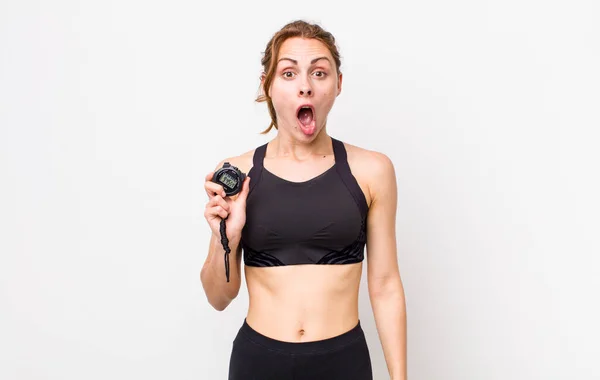 Young Pretty Woman Looking Very Shocked Surprised Fitness Concept Stopwatch — Foto Stock