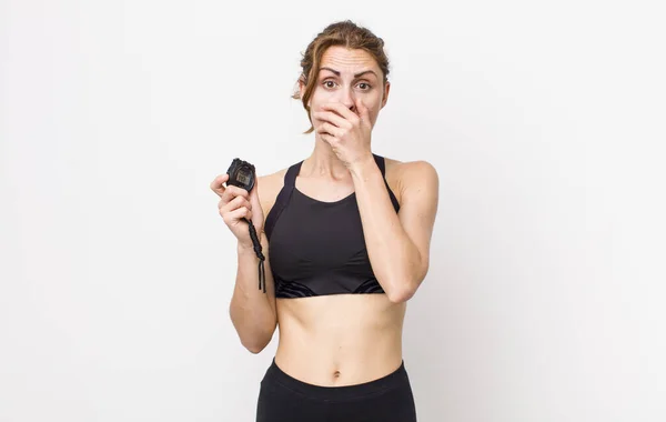 Young Pretty Woman Covering Mouth Hands Shocked Fitness Concept Stopwatch — Stockfoto