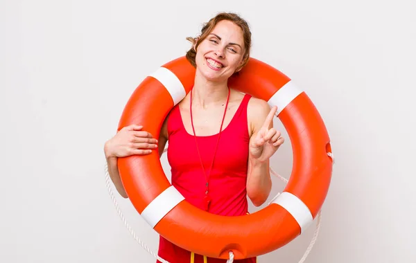 Young Pretty Woman Smiling Looking Friendly Showing Number One Lifeguard — Stock Photo, Image