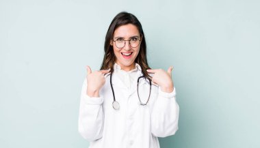 young pretty woman  feeling happy and pointing to self with an excited. physician concept