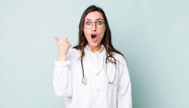 young pretty woman  looking astonished in disbelief. physician concept