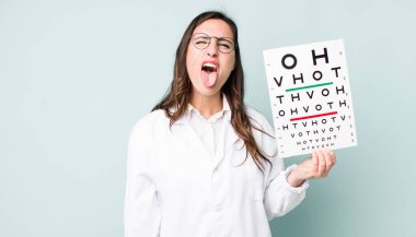 young pretty woman  with cheerful and rebellious attitude, joking and sticking tongue out. optical vision test concept