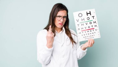 young pretty woman  feeling angry, annoyed, rebellious and aggressive. optical vision test concept