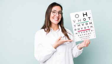 young pretty woman  smiling cheerfully, feeling happy and showing a concept. optical vision test concept