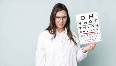 young pretty woman  feeling sad, upset or angry and looking to the side. optical vision test concept