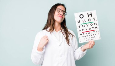 young pretty woman  looking arrogant, successful, positive and proud. optical vision test concept