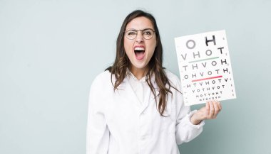 young pretty woman  shouting aggressively, looking very angry. optical vision test concept