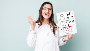 young pretty woman  feeling happy, surprised realizing a solution or idea. optical vision test concept