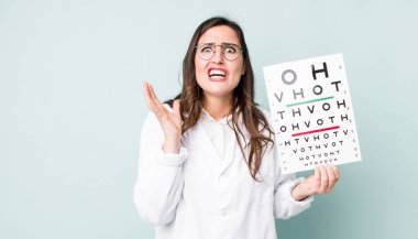 young pretty woman  looking desperate, frustrated and stressed. optical vision test concept