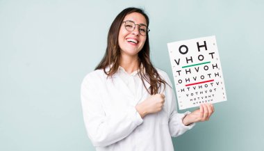 young pretty woman  feeling happy and facing a challenge or celebrating. optical vision test concept