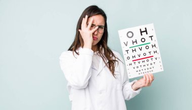 young pretty woman  feeling bored, frustrated and sleepy after a tiresome. optical vision test concept