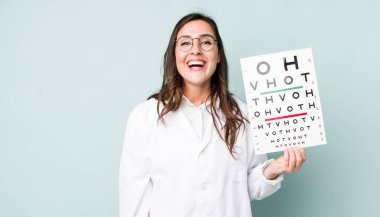 young pretty woman  looking happy and pleasantly surprised. optical vision test concept