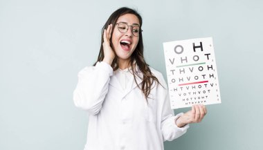young pretty woman  feeling happy, excited and surprised. optical vision test concept