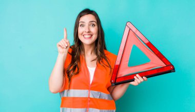 young pretty woman  feeling like a happy and excited genius after realizing an idea. car emergency triangle
