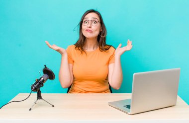 young pretty woman  feeling puzzled and confused and doubting. influencer concept