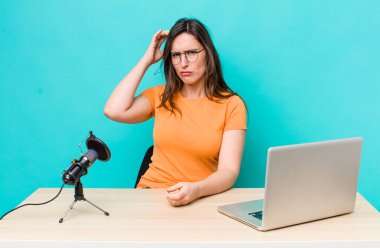 young pretty woman  feeling puzzled and confused, scratching head. influencer concept