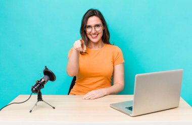 young pretty woman  pointing at camera choosing you. influencer concept