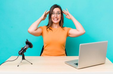 young pretty woman  feeling stressed, anxious or scared, with hands on head. influencer concept