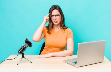 young pretty woman  feeling confused and puzzled, showing you are insane. influencer concept