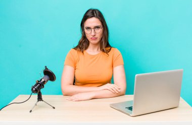 young pretty woman  feeling sad, upset or angry and looking to the side. influencer concept