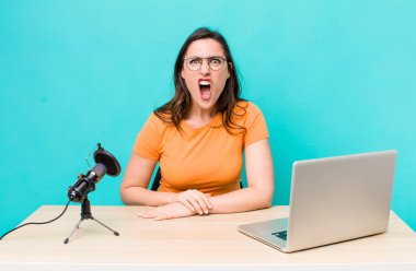 young pretty woman  shouting aggressively, looking very angry. influencer concept