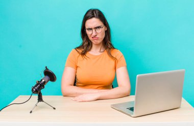 young pretty woman  feeling puzzled and confused. influencer concept