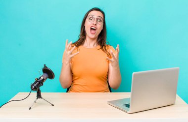 young pretty woman  feeling extremely shocked and surprised. influencer concept