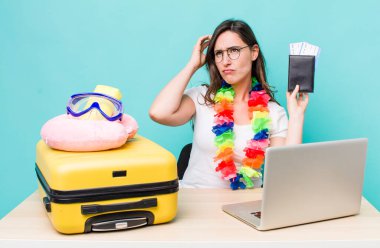 young pretty woman  feeling puzzled and confused, scratching head. summer travel concept