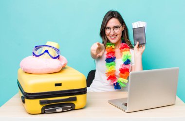 young pretty woman  pointing at camera choosing you. summer travel concept