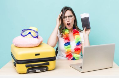 young pretty woman  looking happy, astonished and surprised. summer travel concept