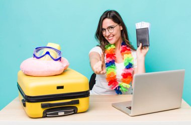 young pretty woman  smiling proudly and confidently making number one. summer travel concept