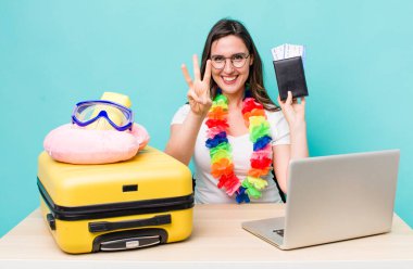 young pretty woman  smiling and looking friendly, showing number three. summer travel concept