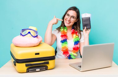 young pretty woman  smiling confidently pointing to own broad smile. summer travel concept