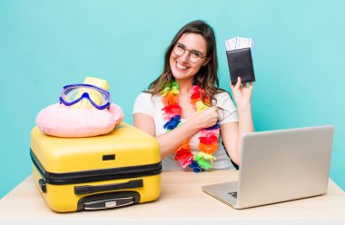 young pretty woman  feeling happy and facing a challenge or celebrating. summer travel concept