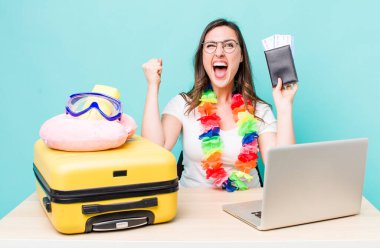 young pretty woman  shouting aggressively with an angry expression. summer travel concept