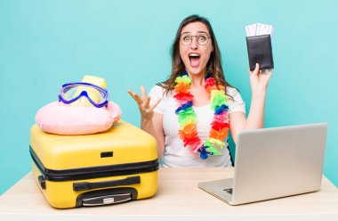 young pretty woman  feeling extremely shocked and surprised. summer travel concept