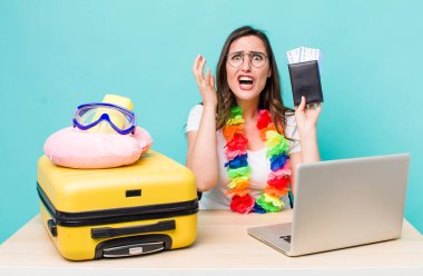 young pretty woman  looking desperate, frustrated and stressed. summer travel concept