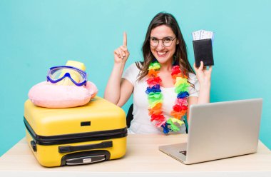 young pretty woman  feeling like a happy and excited genius after realizing an idea. summer travel concept