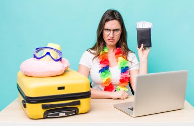 young pretty woman  feeling puzzled and confused. summer travel concept