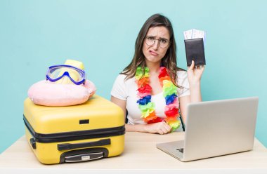 young pretty woman  feeling sad and whiney with an unhappy look and crying. summer travel concept