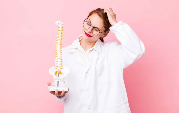 Young Pretty Woman Feeling Puzzled Confused Scratching Head Spine Specialist — Stockfoto