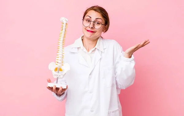 Young Pretty Woman Feeling Puzzled Confused Doubting Spine Specialist Concept — Stockfoto
